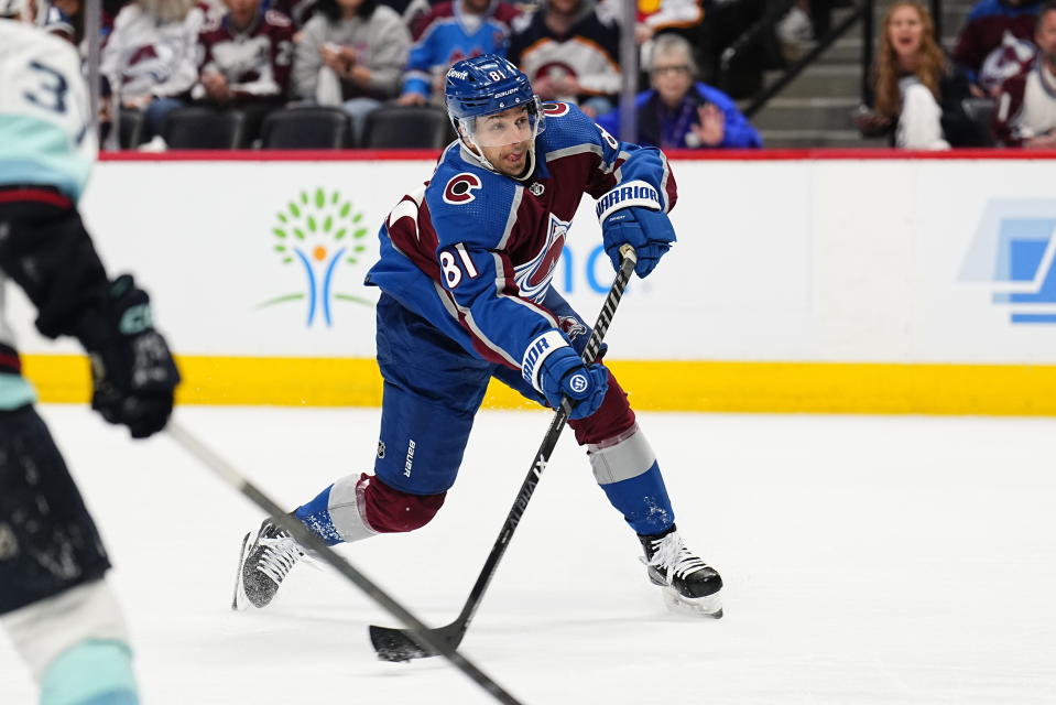 Colorado Avalanche center Denis Malgin shoots against the Seattle Kraken during the first period of Game 1 of a first-round NHL hockey playoff series Tuesday, April 18, 2023, in Denver. (AP Photo/Jack Dempsey)