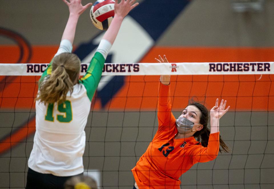 Rochester's Ellie Gegen (13) has her hit blocked by Normal U-High's Maycie Welborn (19) during the championship game of the CS8 Volleyball Tournament at the Rochester Athletic Complex in Rochester, Ill., Thursday, April 22, 2021. [Justin L. Fowler/The State Journal-Register] 