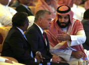 Saudi Crown Prince, Mohammed bin Salman, right, talks to Jordan's King Abdullah II, center, at the Future Investment Initiative conference, in Riyadh, Saudi Arabia, Tuesday, Oct. 23, 2018. The high-profile economic forum in Saudi Arabia is the kingdom's first major event on the world stage since the killing of writer Jamal Khashoggi at the Saudi Consulate in Istanbul earlier this month. (AP Photo/Amr Nabil)