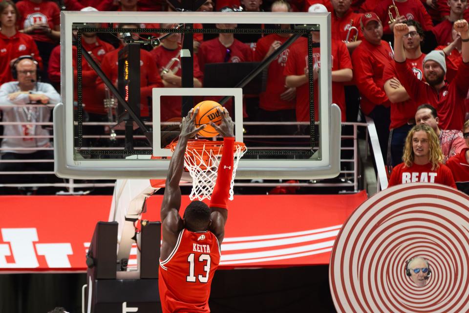 Utah Utes center Keba Keita (13) dunks the ball during a men’s basketball game against the Brigham Young Cougars at the Jon M. Huntsman Center in Salt Lake City on Saturday, Dec. 9, 2023. | Megan Nielsen, Deseret News