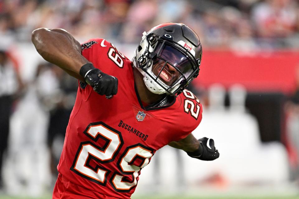 Tampa Bay Buccaneers safety Christian Izien celebrates after recovering a fumble during the first half of an NFL preseason football game against the Baltimore Ravens Saturday, Aug. 26, 2023, in Tampa, Fla. (AP Photo/Jason Behnken)