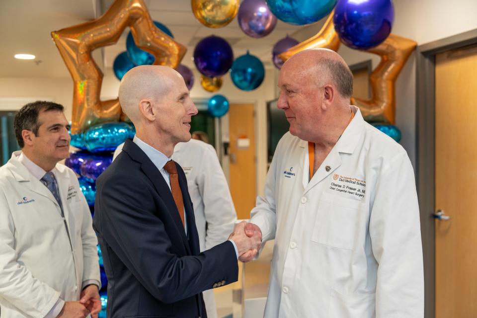 Michael Wiggins, the president of Dell Children's, and Dr. Charles Fraser, the head of the Texas Center for Pediatric and Congenital Heart Disease, congratulate each other on the opening of the second cardiac intensive care unit.