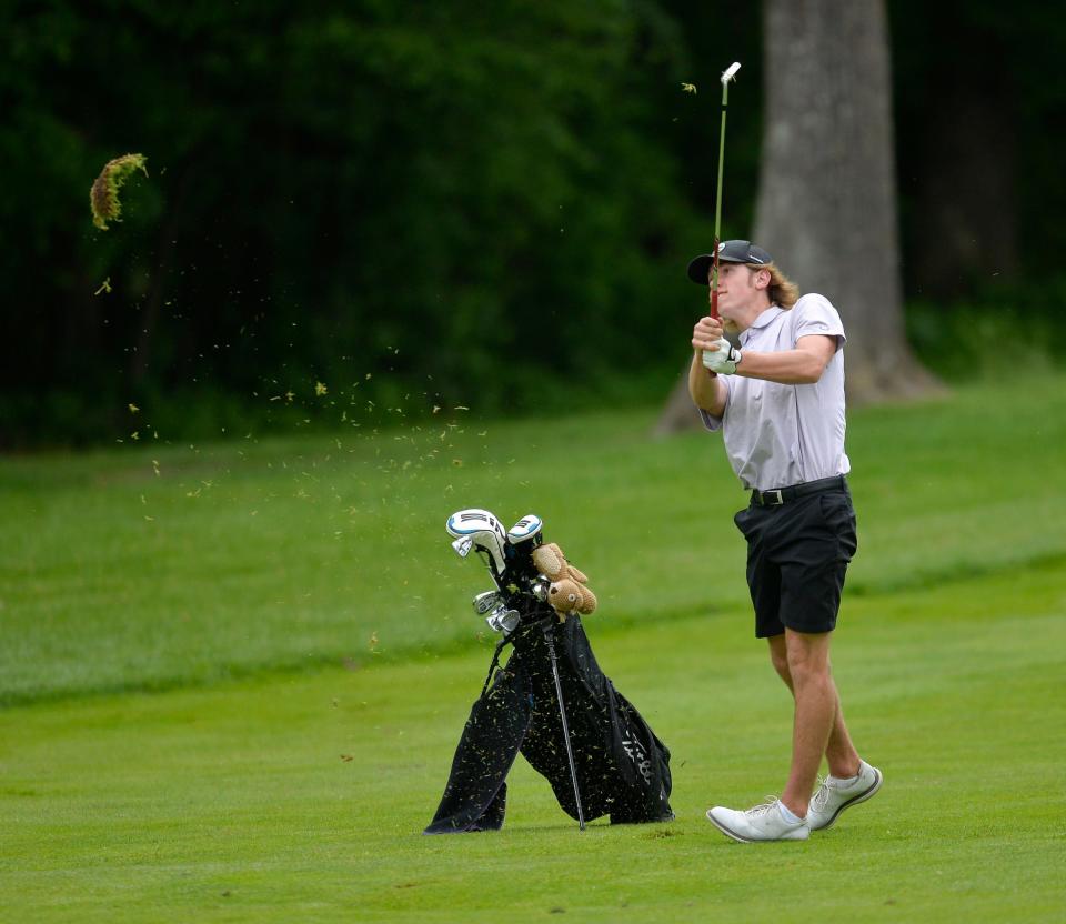 Albany's Zac Kreuzer watches his approach shot as grass flies from his shot as Albany and Cathedral boys and girls golf compete in the Section 6-2A tournament on Tuesday, June 7, 2022, at Blackberry Ridge Golf Course in Sartell. 