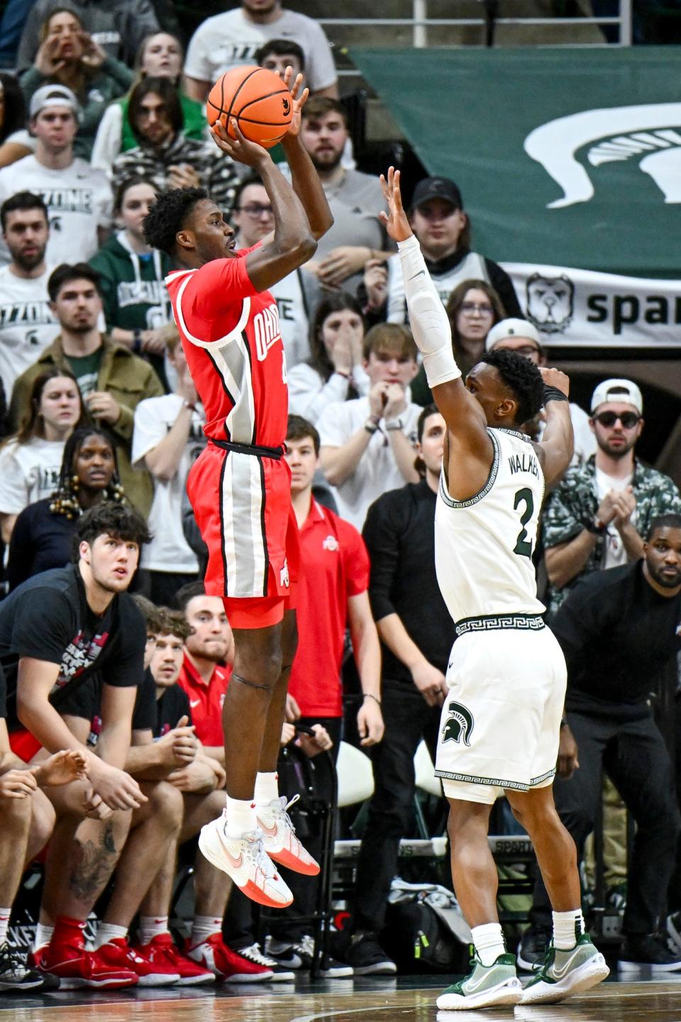 Ohio State's Dale Bonner, left, hits a game winning 3-pointer as Michigan Sate's Tyson Walker defends during the second half on Sunday, Feb. 25, 2024, at the Breslin Center in East Lansing.
