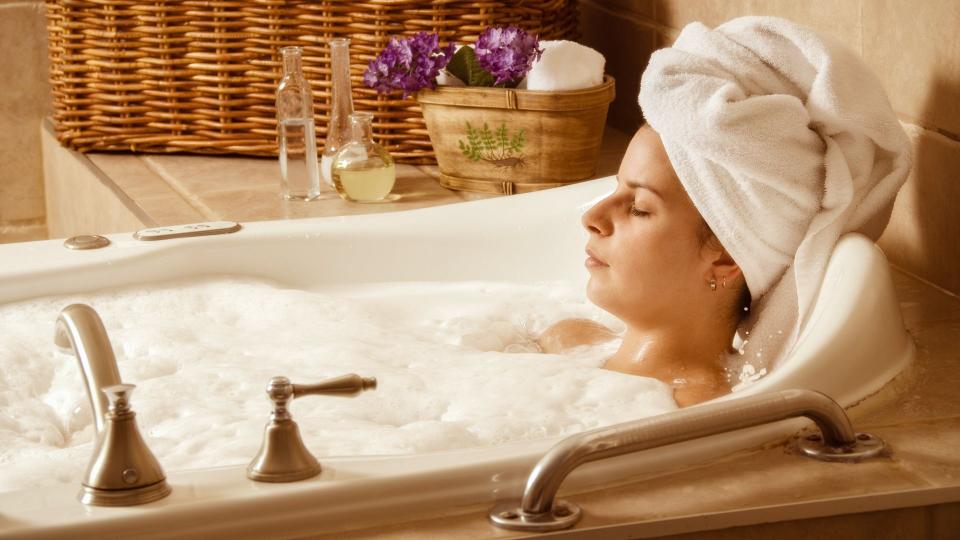 woman relaxing in a bubble bath