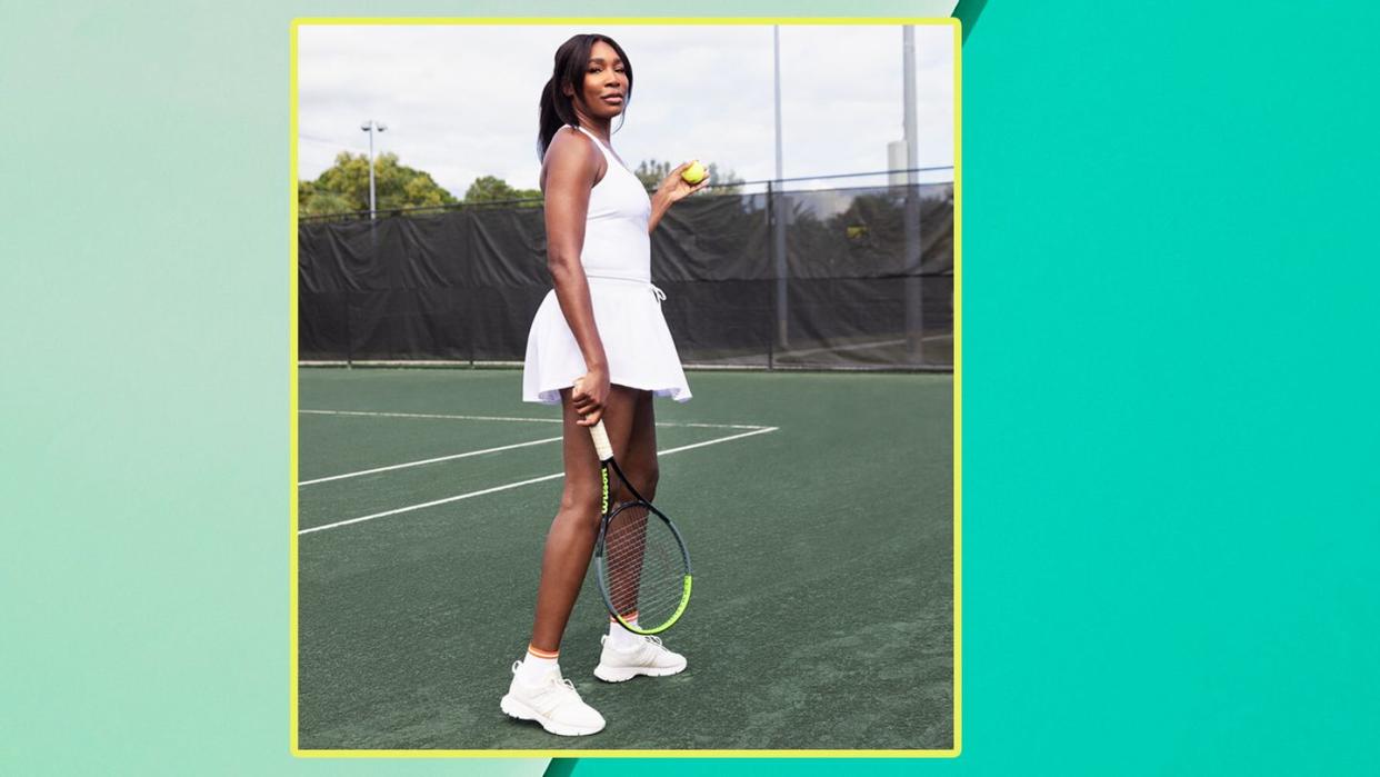 a woman holding a tennis racket