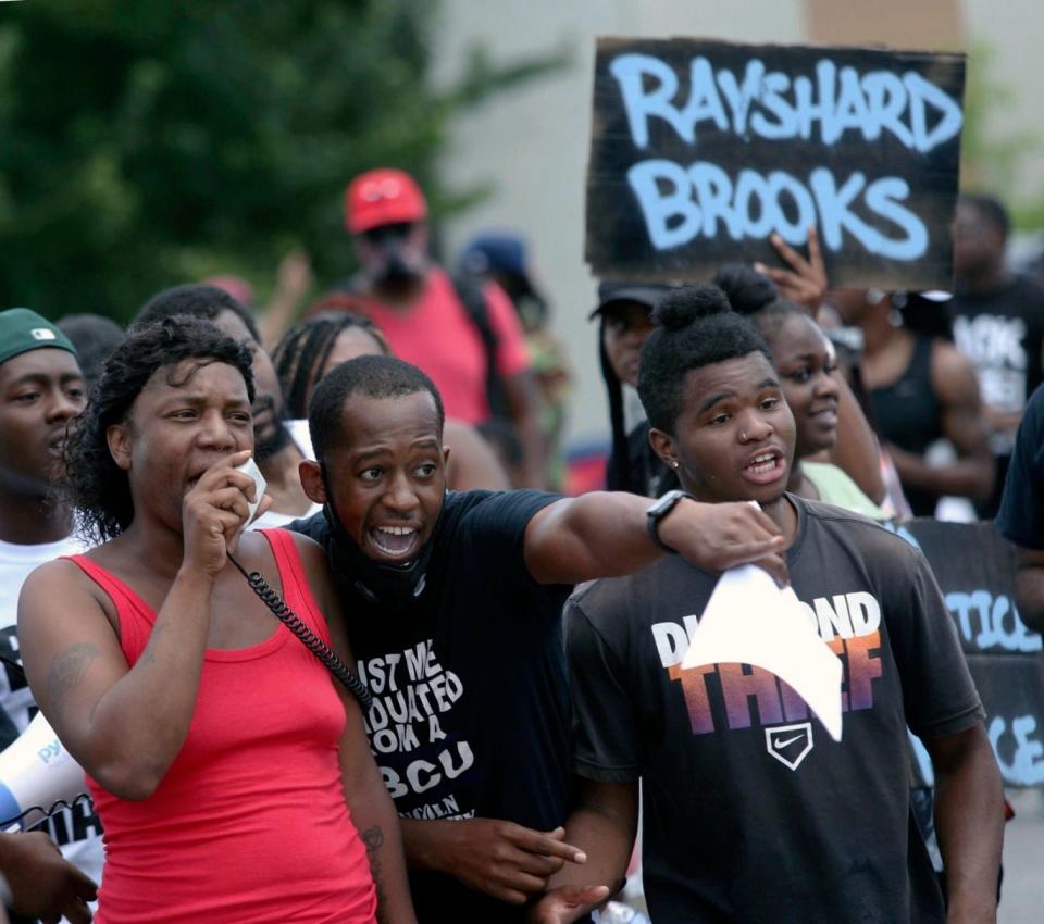 Protestors gather on University Ave near a Wendy's restaurant, Saturday, June 13, 2020 in Atlanta.