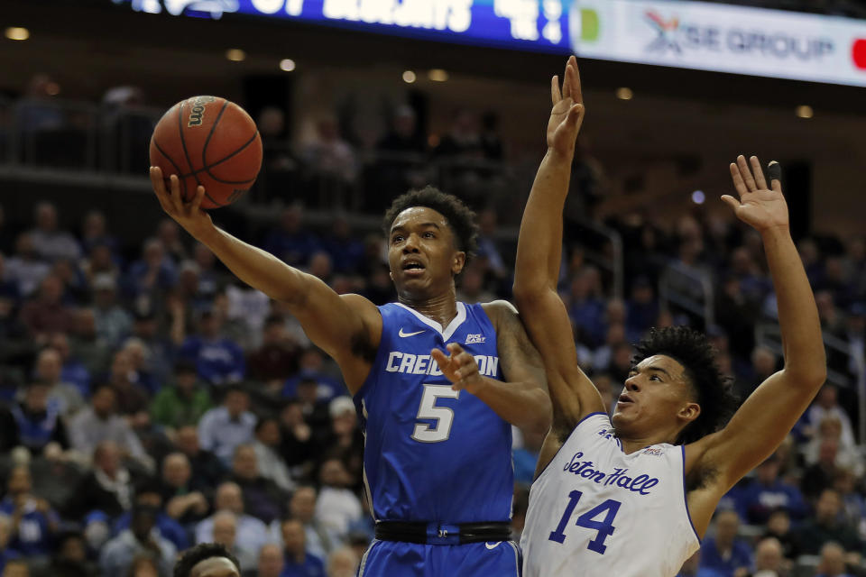 Creighton guard Ty-Shon Alexander (5) drives to the basket past Seton Hall guard Jared Rhoden (14) during the first half of an NCAA college basketball game Wednesday, Feb. 12, 2020, in Newark, N.J.. (AP Photo/Adam Hunger)