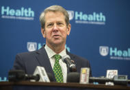 FILE - In this March 17, 2020, file photo, Georgia Gov. Brian Kemp answers questions from reporters during a news conference following a COVID-19 Vaccine Roundtable meeting at Augusta University in Augusta, Ga. Kemp, a Republican, has blasted Major League Baseball for what he called a “knee-jerk decision” to pull the 2021 All-Star Game from Atlanta over the league’s objection to a sweeping new Georgia voting law that critics say is too restrictive. Kemp insists the laws critics have misconstrued what the law does. (Michael Holahan/The Augusta Chronicle via AP, File)