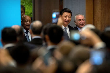 (L-R) South African President Jacob Zuma, Chinese President Xi Jinping, and Brazilian President Michel Temer arrive for the opening ceremony of the BRICS Business Forum at the Xiamen International Conference and Exhibition Center in Xiamen, China September 3, 2017. REUTERS/Mark Schiefelbein/Pool