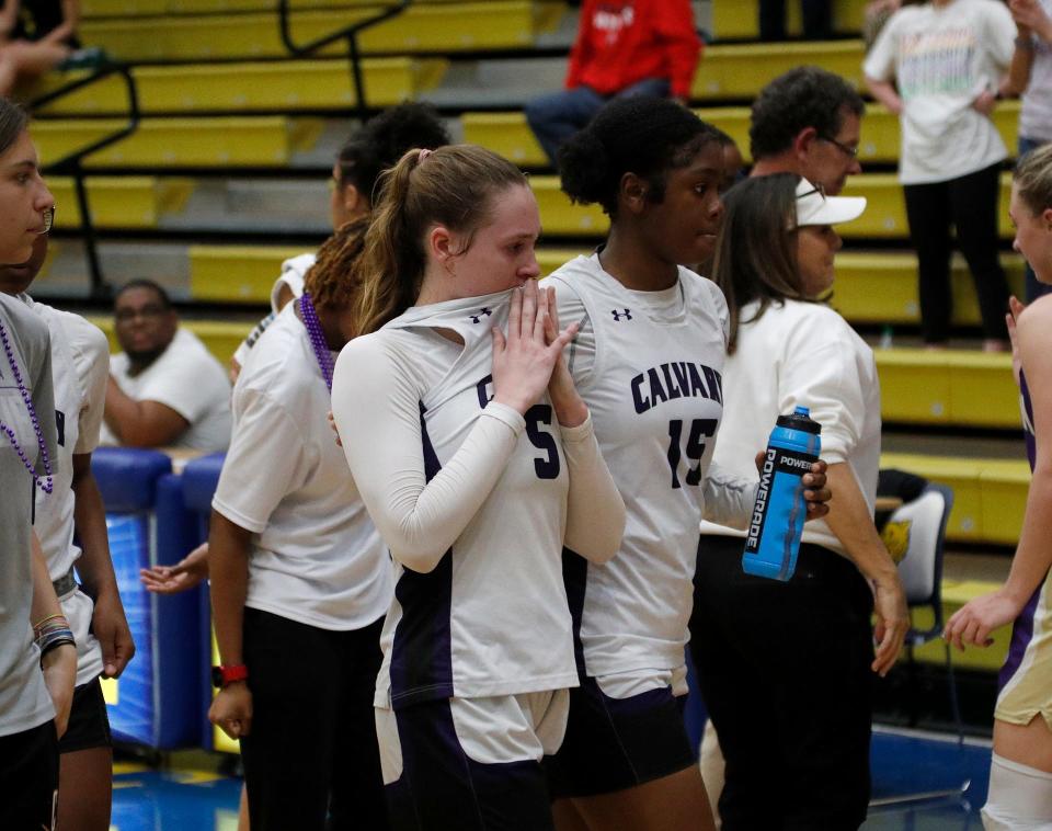 Calvary's Hannah Cail and Damaris Shields walk off the court together following the Cavaliers loss to Lumpkin County in the 3A semifinals at Fort Valley State University.