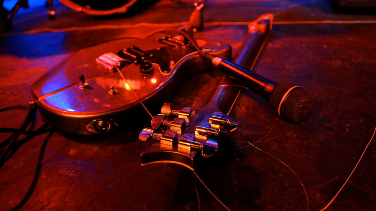  Generic view of a smashed electric guitar on a stage. 