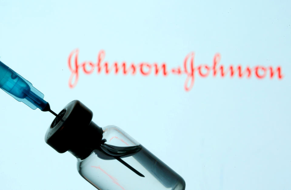 FILE PHOTO: A vial and sryinge are seen in front of a displayed Johnson&Johnson logo in this illustration taken January 11, 2021. REUTERS/Dado Ruvic/Illustration/File Photo/File Photo