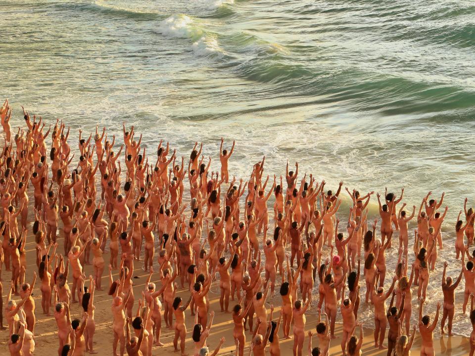 Group of nude people on Bondi Beach for cancer awareness photo shoot