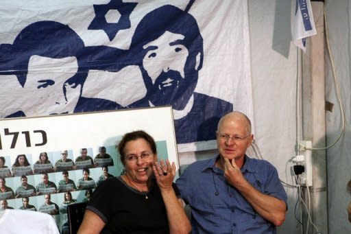 Noam and Aviva Shalit, parents of abducted Israeli soldier Gilad Shalit, sit at the family's protest tent on the 1,934th day for their son's captivity. Israel is waiting to hear when Shalit would return home, a day after the Jewish state inked a deal with Hamas that will see 1,000 Palestinian prisoners freed