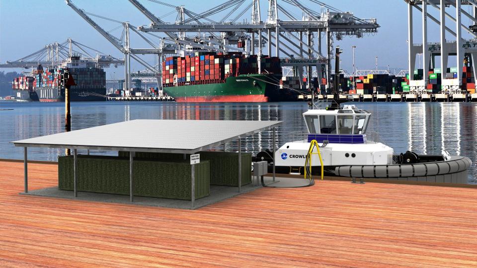 A rendering shows the all-electric tugboat that Jacksonville-based Crowley is developing. The tugboat, shown connected to a charging station, will not have any stack on it for fuel emissions.
