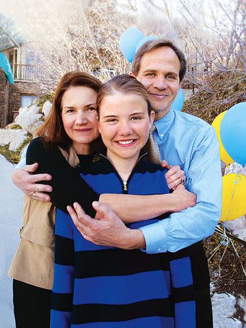 Lois and Ed Smart hug their daughter, Elizabeth, at the Smart home March 13, 2003 in Salt Lake City, Utah. Elizabeth was kidnapped at gunpoint last June and was traveling across the country with her captors.