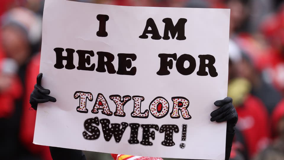 Fans display signs in support of Taylor Swift during a Raiders-Chiefs football game in Kansas City in December. - Jamie Squire/Getty Images