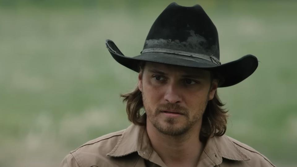 Luke Grimes as Kayce in a cowboy hat in Yellowstone.