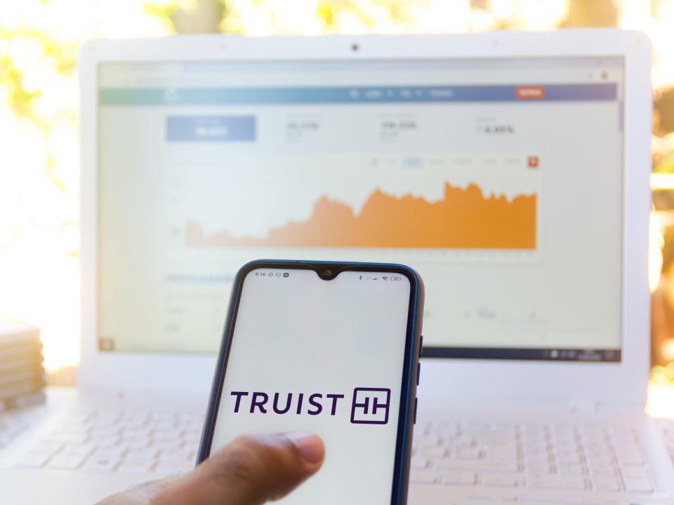 In this photo illustration the Truist Financial Corporation logo seen displayed on a smartphone.
