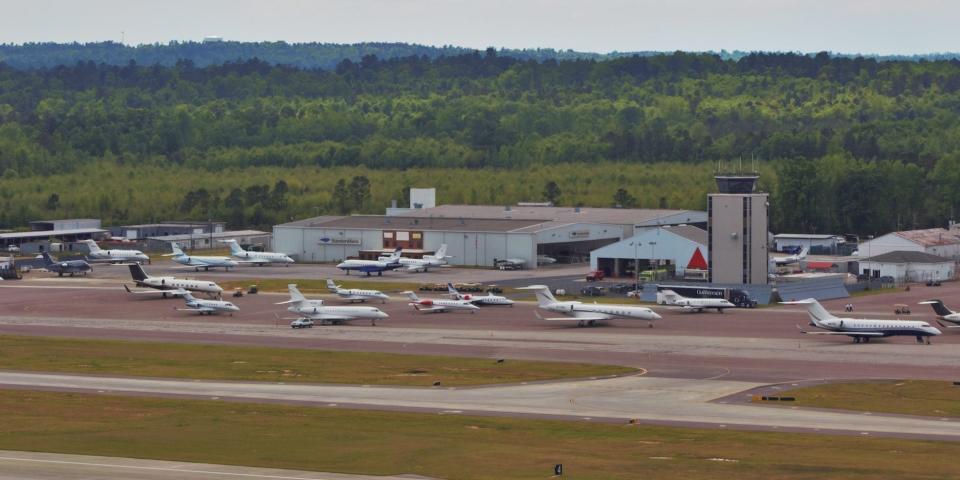 Several jets wait outside of Augusta Regional Airport.