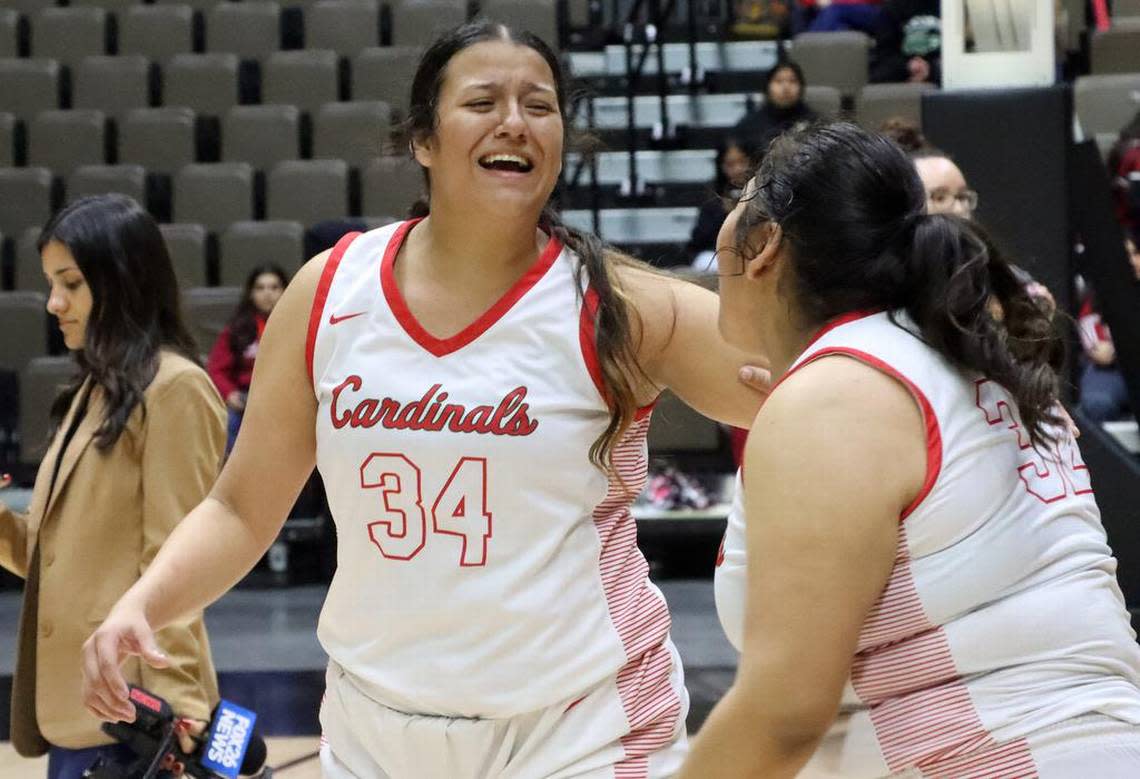Lindsay High junior Adaliya Turner reaches out to sophomore teammate Brianna Jara after helping the fifth-seeded Cardinals to a 53-37 win over No. 2 Matilda Torres High of Madera for the CIF Central Section Division VI girls championship at Selland Arena on Feb. 24, 2023.