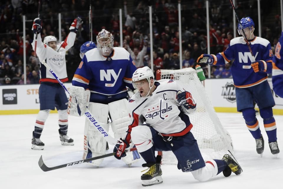 Washington Capitals' Alex Ovechkin celebrates after scoring a goal during the third period of an NHL hockey game as New York Islanders goaltender Semyon Varlamov (40) watches Saturday, Jan. 18, 2020, in Uniondale, N.Y. Ovechkin scored three goals as the Capitals won 6-4. (AP Photo/Frank Franklin II)