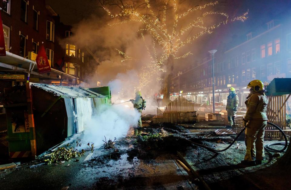 Firefighters work to extinguish a fire on the Groene Hilledijk in RotterdamANP/AFP via Getty Images