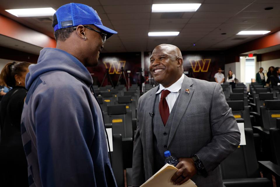 Eric Bieniemy talks with Washington wide receiver Terry McLaurin after being introduced as the new Commanders offensive coordinator.