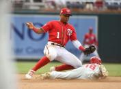 Jun 23, 2018; Washington, DC, USA; Philadelphia Phillies second baseman Cesar Hernandez (16) beats the tag by Washington Nationals second baseman Wilmer Difo (1) to steal second base during the seventh inning at Nationals Park. Mandatory Credit: Brad Mills-USA TODAY Sports