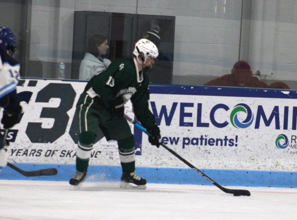 Cooper Carignan of Oakmont readies to send a pass to a teammate in a game against Worcester on Jan. 13, 2024.