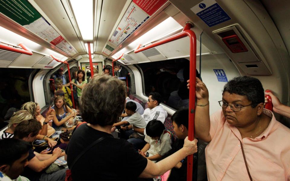 Commuters travel on the Central Line - AP