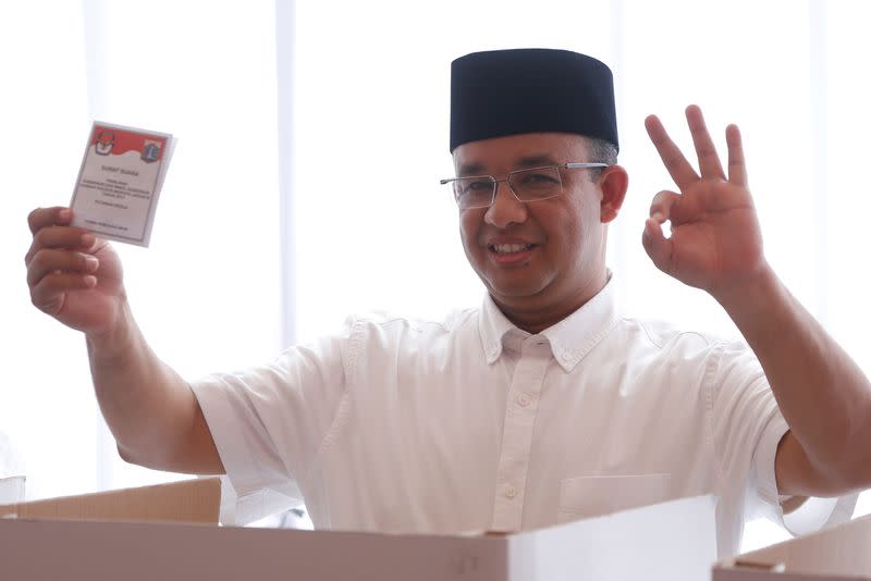 Candidate Anies Baswedan casts his vote in the Jakarta governor election in South Jakarta