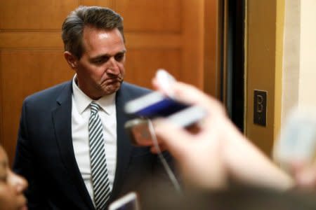 U.S. Senator Jeff Flake (R-AZ) talks to reporters as he arrives for the weekly Republican party caucus luncheon at the U.S. Capitol in Washington, U.S. October 31, 2017.  REUTERS/Jonathan Ernst