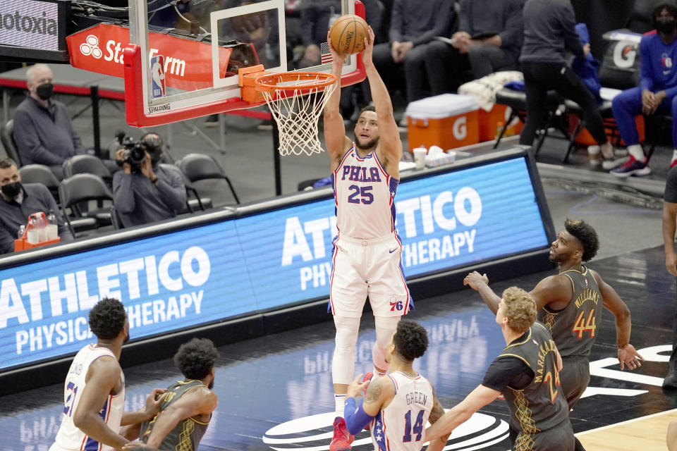 Philadelphia 76ers' Ben Simmons (25) goes up for a dunk during the first half of an NBA basketball game against the Chicago Bulls Monday, May 3, 2021, in Chicago. (AP Photo/Charles Rex Arbogast)