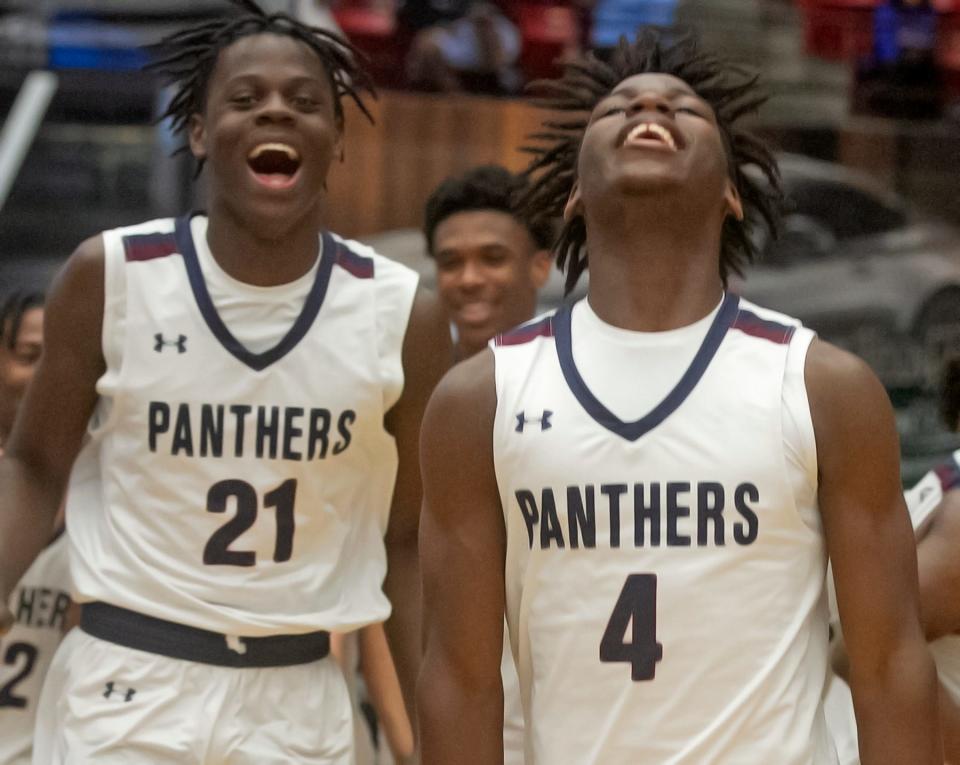 Dwyer High School players Derkkentz Geffrard, left, and Robert Jones celebrate their victory over Ponte Vedra during their FHSAA Boys 6A Championship basketball game at The RP Funding Center in Lakeland Saturday. March 4, 2023.