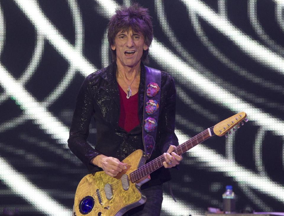 Ronnie Wood of The Rolling Stones performs at the O2 arena in east London, Sunday, Nov. 25, 2012. The band are playing four gigs to celebrate their 50th anniversary, including two shows at London’s O2 and two more in New York. (Photo by Joel Ryan/Invision/AP)