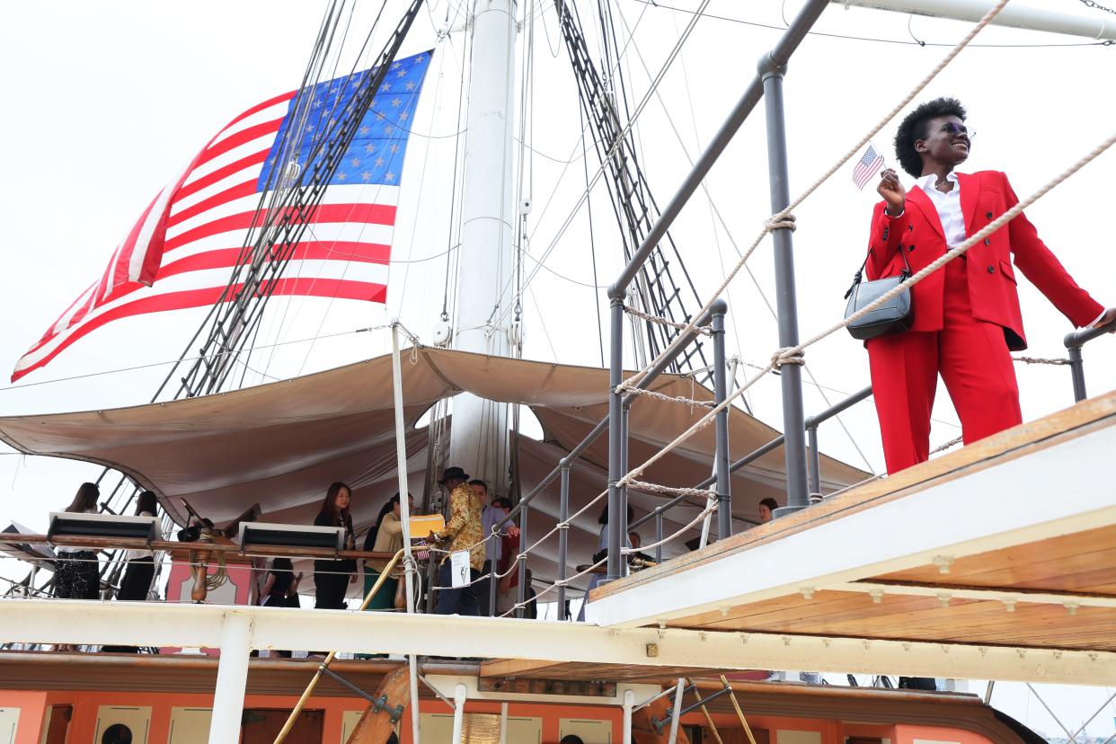 Mary Orji has her photo taken after the conclusion of a naturalization ceremony on the Wavertree on June 14, 2023 in New York City. U.S. Citizenship and Immigration Services and the South Street Seaport Museum celebrated Flag Day by welcoming 20 new U.S. citizens by hosting a naturalization ceremony aboard the 1885 Tall Ship Wavertree. The 20 candidates were from 17 countries and 5 of the candidates are current or former members of the U.S. Military. 