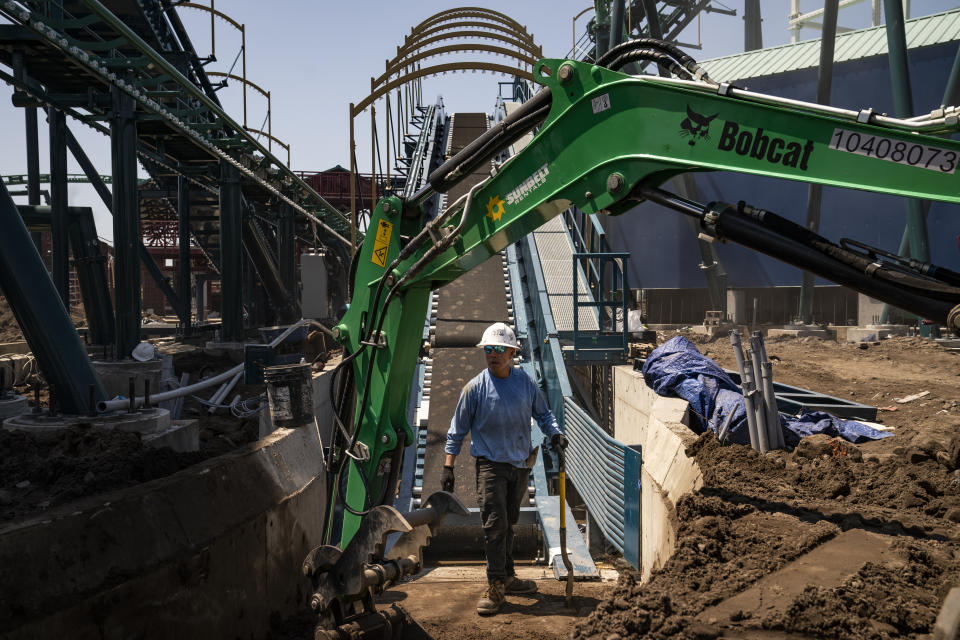 Construction is underway in the amusement park district of Coney Island, Friday, June 17, 2022, in the Brooklyn borough of New York. Luna Park in Coney Island will open three new major attractions this season alongside new recreational areas and pedestrian plazas. (AP Photo/John Minchillo)