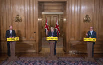 From left, Chief Medical Officer Chris Whitty, Prime Minister Boris Johnson and Chief scientific adviser Sir Patrick Vallance speaks during a media briefing on COVID-19, in Downing Street, London, Friday Jan. 15, 2021. (Dominic Lipinski/Pool via AP)