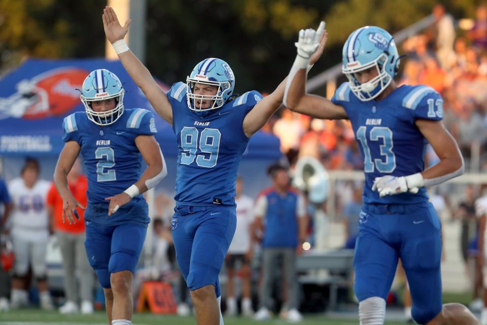 Olentangy Berlin's Spencer Conrad (99) celebrates with teammates Harrison Brewster (2) and Jared Moeller (13) after kicking a 49-yard field goal against Olentangy Orange on Aug. 26.