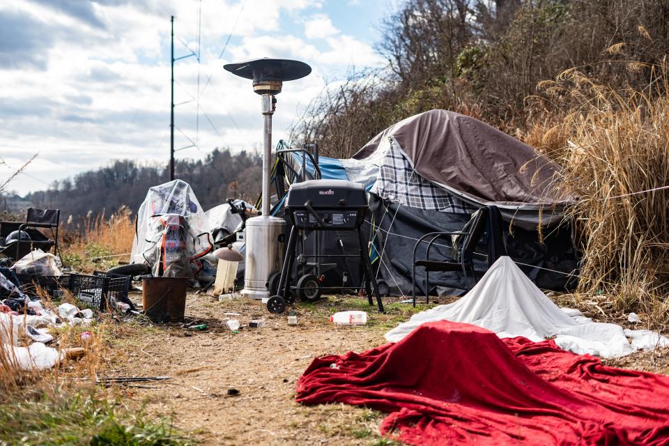 An encampment had been growing along the French Broad River where construction has begun for a greenway for several months.