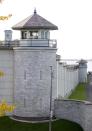 A view of the Kingston Penitentiary in Kingston, Ontario October 11, 2013. British North America's first penitentiary, the "Kingston Pen" as it is known, is now closed. Situated on prime real estate on the shore of Lake Ontario, its fate is unknown despite being designated as a National Historic Site. Public tours are currently being held to raise money for the United Way. The prison was once home to Canada's most famous criminals including Canadian serial killers Clifford Olson and Paul Bernardo. REUTERS/Fred Thornhill (CANADA - Tags: CRIME LAW SOCIETY)