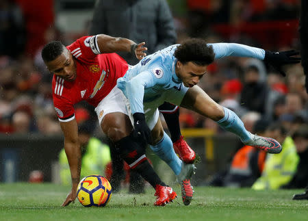 Soccer Football - Premier League - Manchester United vs Manchester City - Old Trafford, Manchester, Britain - December 10, 2017 Manchester City's Leroy Sane in action with Manchester United's Antonio Valencia Action Images via Reuters/Carl Recine