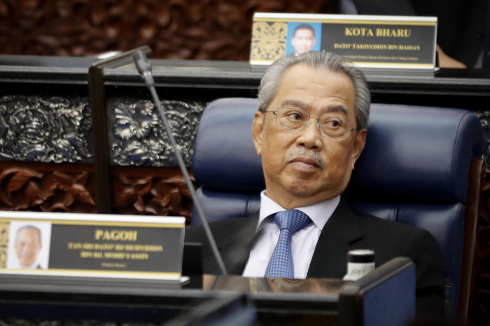 FILE - Malaysian Prime Minister Muhyiddin Yassin attends a parliament session at lower house in Kuala Lumpur, Malaysia, July 13, 2020. Former Malaysian Prime Minister Muhyiddin Yassin arrived Thursday, March 9, 2023 at the anti-graft agency office for a second time in a month over alleged corruption in the award of government projects under his rule. (AP Photo/Vincent Thian, File)