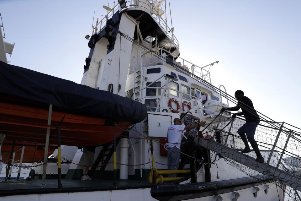 The Open Arms ship is moored at the Naples harbor, Italy, Thursday, June 20,2 019. The Spanish NGO migrant ship Open Arms is in Naples with activists speaking to media and the public to mark World Refugee Day. (AP Photo/Andrew Medichini)
