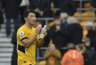 Wolverhampton Wanderers' Hwang Hee-chan applauds supporters at the end of the English Premier League soccer match between Wolverhampton Wanderers and Newcastle United at Molineux stadium in Wolverhampton, England, Saturday, Oct. 2, 2021. (AP Photo/Rui Vieira)