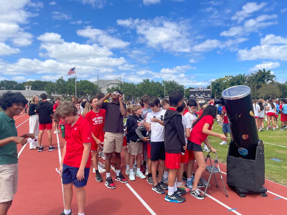 Students at Saint Andrew's School in Boca Raton flocked to the school's football field to watch the solar eclipse on April 8, 2024.
