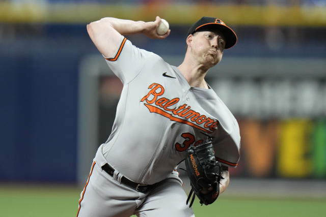 Baltimore Orioles second baseman Adam Frazier (12) throws to first