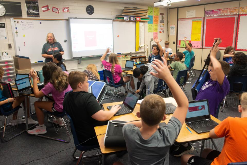 Jenny Wilcox, seventh-grade math teacher at Washburn Rural Middle School, asks for class participation for whoever brought their supplies in Friday morning.